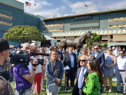 Jerry Hollendorfer being interviewed by TVG host Britney Eurton prior to More Ice running in the Santa Anita Derby on April 6, 2019 (Carter Biddle) 